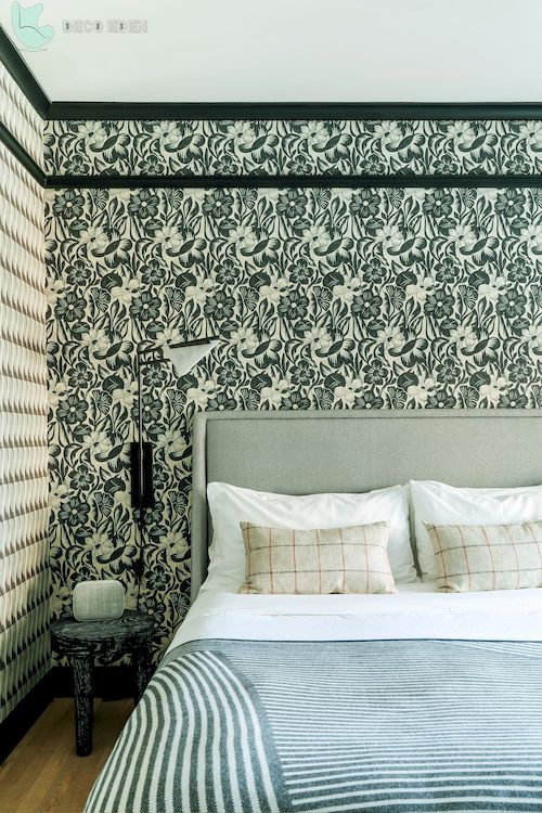 bedroom with patterned wallpaper and bedframe final