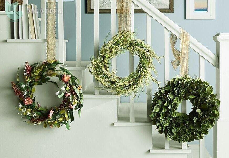 three christmas wreaths on staircase final